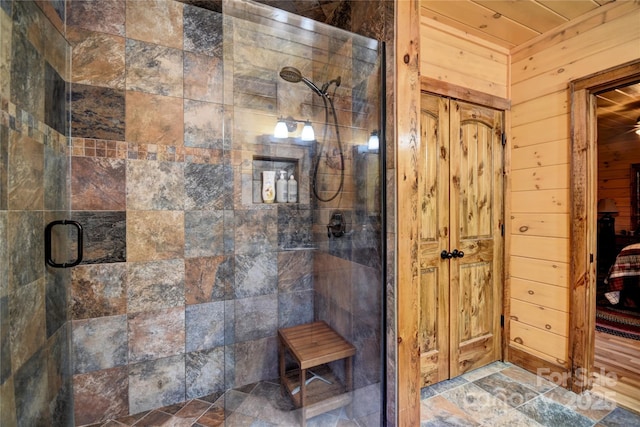 36 Destiny Trl, Maggie Valley, NC 28751 - bathroom featuring a shower stall and wood walls