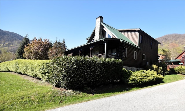 36 Destiny Trl, Maggie Valley, NC 28751 - view of property exterior with a chimney and a mountain view