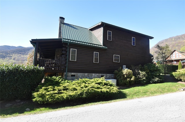36 Destiny Trl, Maggie Valley, NC 28751 - view of home's exterior with a chimney, a mountain view, log siding, and metal roof