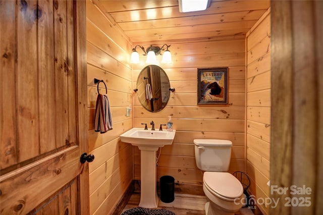 36 Destiny Trl, Maggie Valley, NC 28751 - bathroom with toilet, wooden walls, wood finished floors, a sink, and wooden ceiling