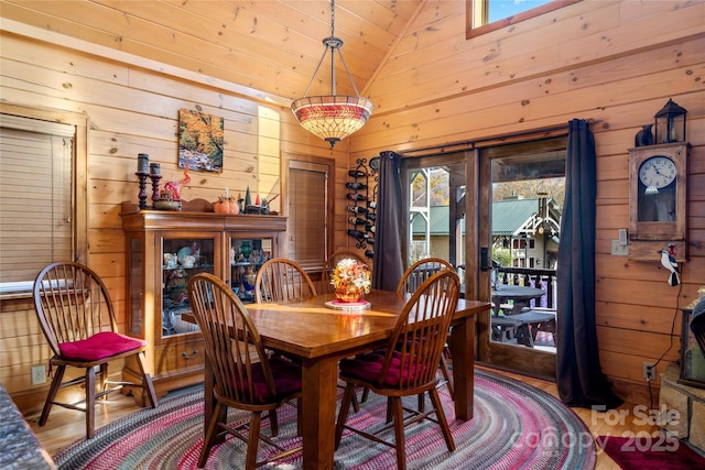 36 Destiny Trl, Maggie Valley, NC 28751 - dining space with wood walls, wood finished floors, wooden ceiling, and high vaulted ceiling
