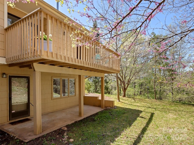 view of yard with a patio and a wooden deck