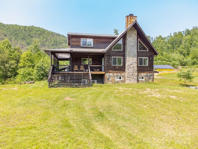 146 W Green Briar Ln, Green Mountain, NC 28740 - rear view of house with a lawn and a chimney
