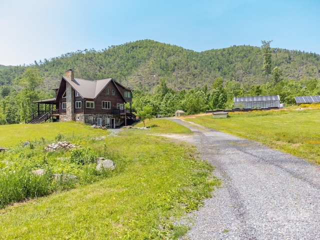 146 W Green Briar Ln, Green Mountain, NC 28740 - view of dirt / gravel road featuring a forest view and a mountain view