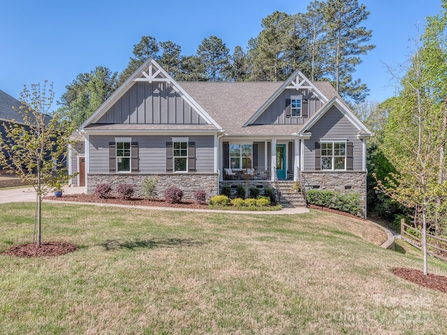 143 Robinson Ridge Dr, Mooresville, NC 28117 - craftsman-style house featuring board and batten siding, a porch, roof with shingles, stone siding, and a front lawn