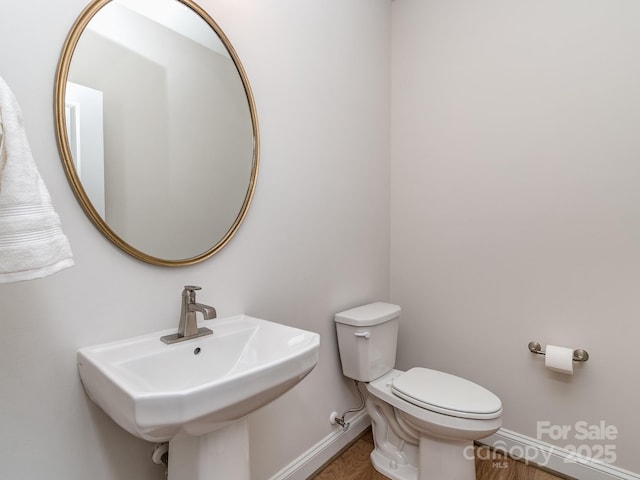 143 Robinson Ridge Dr, Mooresville, NC 28117 - bathroom featuring toilet, a sink, and baseboards