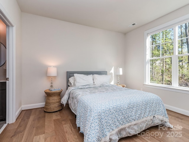 143 Robinson Ridge Dr, Mooresville, NC 28117 - bedroom featuring visible vents, baseboards, and wood finished floors