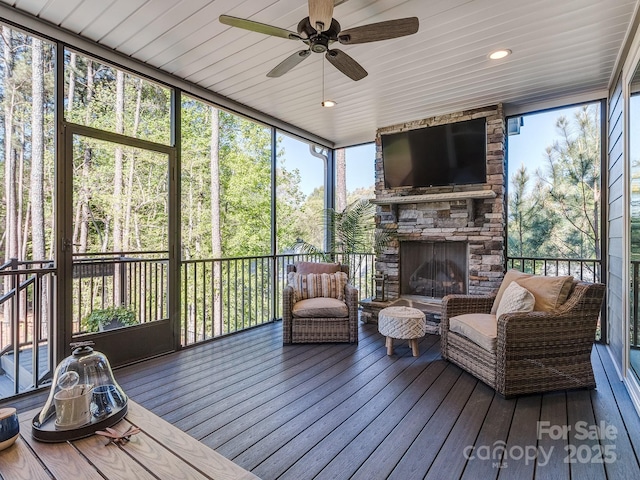143 Robinson Ridge Dr, Mooresville, NC 28117 - sunroom / solarium featuring ceiling fan and a fireplace