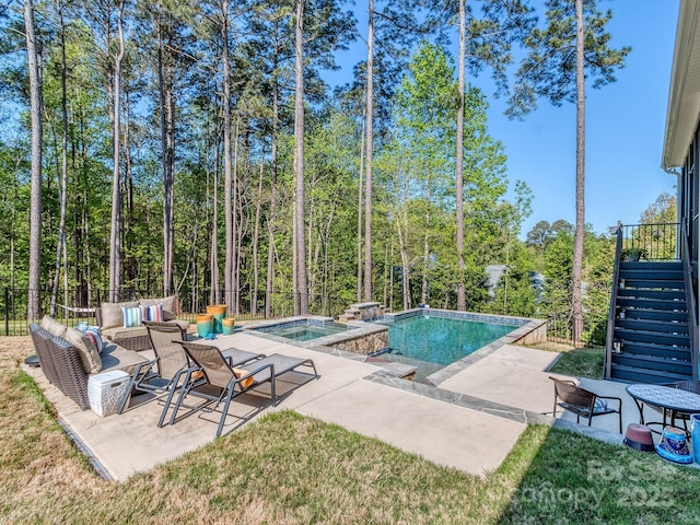 143 Robinson Ridge Dr, Mooresville, NC 28117 - view of swimming pool with a patio area, a pool with connected hot tub, fence, and stairway