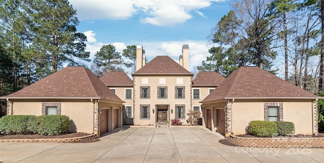 3005 Dream Catcher Cir, Fort Mill, SC 29715 - view of front of property with driveway, a chimney, a shingled roof, and stucco siding