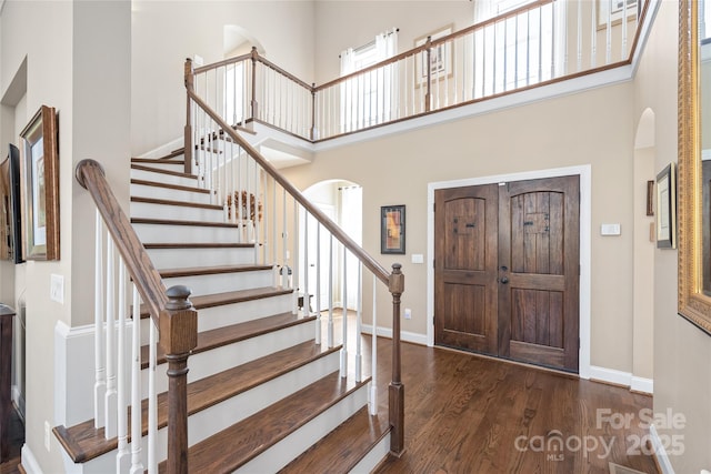 3005 Dream Catcher Cir, Fort Mill, SC 29715 - entrance foyer featuring wood finished floors, arched walkways, baseboards, and a high ceiling