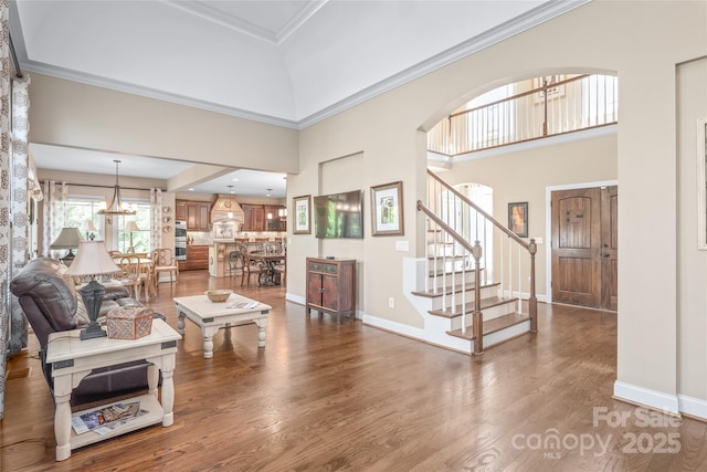 3005 Dream Catcher Cir, Fort Mill, SC 29715 - living area with an inviting chandelier, baseboards, dark wood-style floors, and stairs