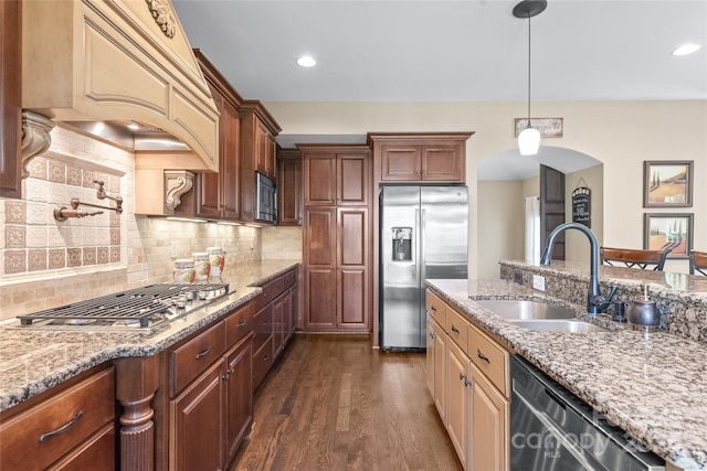3005 Dream Catcher Cir, Fort Mill, SC 29715 - kitchen featuring tasteful backsplash, a sink, light stone counters, stainless steel appliances, and dark wood-type flooring