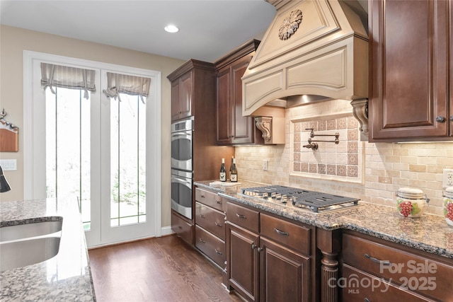 3005 Dream Catcher Cir, Fort Mill, SC 29715 - kitchen featuring a sink, custom exhaust hood, stainless steel appliances, and light stone countertops