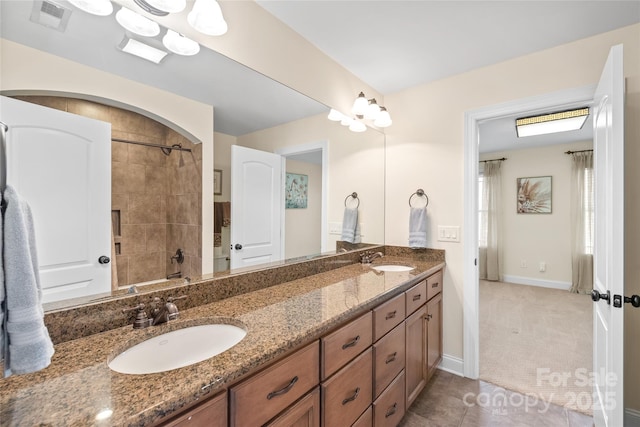 3005 Dream Catcher Cir, Fort Mill, SC 29715 - bathroom featuring double vanity, a sink, baseboards, and visible vents