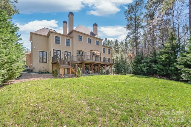 3005 Dream Catcher Cir, Fort Mill, SC 29715 - rear view of house featuring a wooden deck, stucco siding, a chimney, a lawn, and stairway
