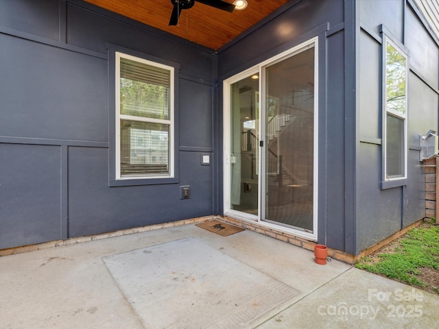 entrance to property featuring a patio area and ceiling fan