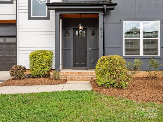 entrance to property with a yard