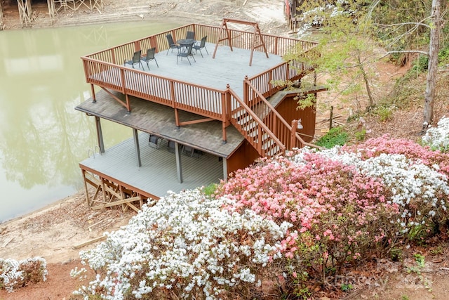 exterior space featuring outdoor dining space and stairway
