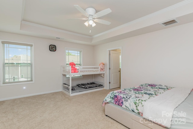 bedroom with a raised ceiling, carpet, ornamental molding, and visible vents