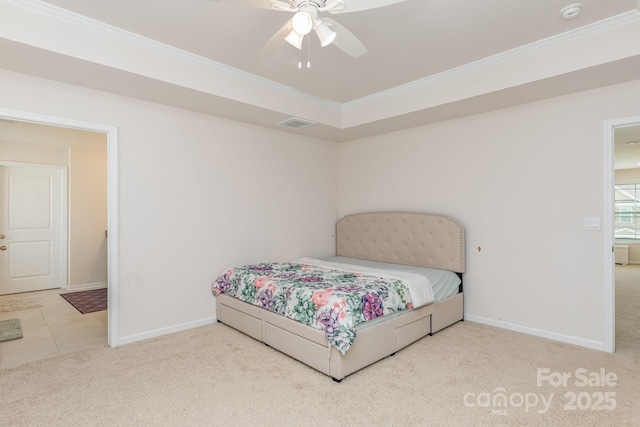 carpeted bedroom featuring visible vents, baseboards, crown molding, and a ceiling fan