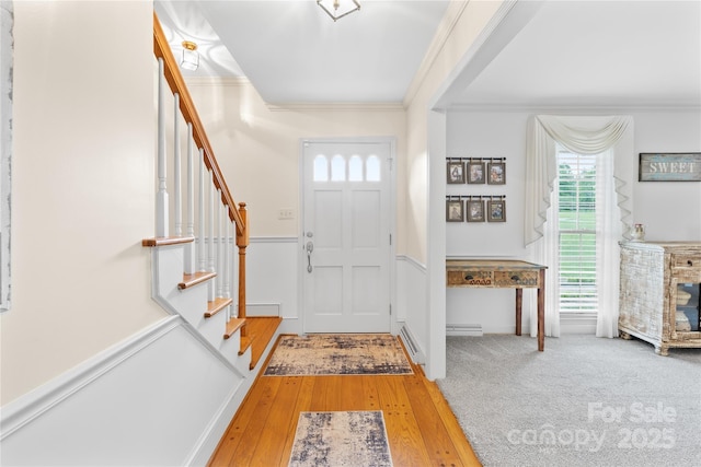 4896 Pageland Hwy, Lancaster, SC 29720 - foyer with ornamental molding, stairway, wood-type flooring, and a wainscoted wall