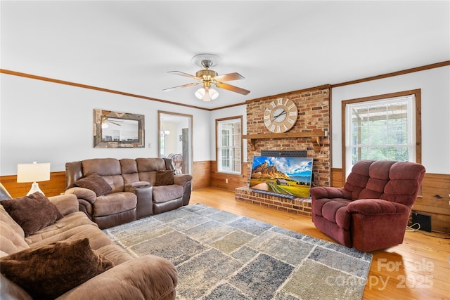 4896 Pageland Hwy, Lancaster, SC 29720 - living room with healthy amount of natural light, ornamental molding, wood finished floors, wooden walls, and wainscoting