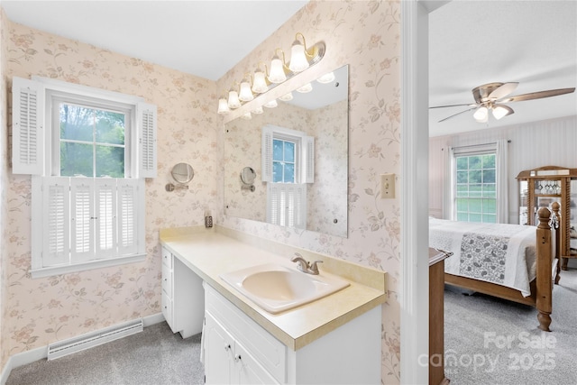 4896 Pageland Hwy, Lancaster, SC 29720 - bathroom with vanity, ensuite bath, a baseboard heating unit, ceiling fan, and wallpapered walls