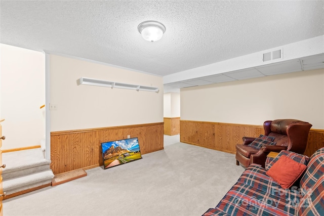 4896 Pageland Hwy, Lancaster, SC 29720 - living area with a wainscoted wall, wooden walls, carpet floors, and a textured ceiling