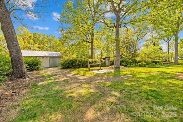 4896 Pageland Hwy, Lancaster, SC 29720 - view of green lawn with an outdoor structure and a detached garage