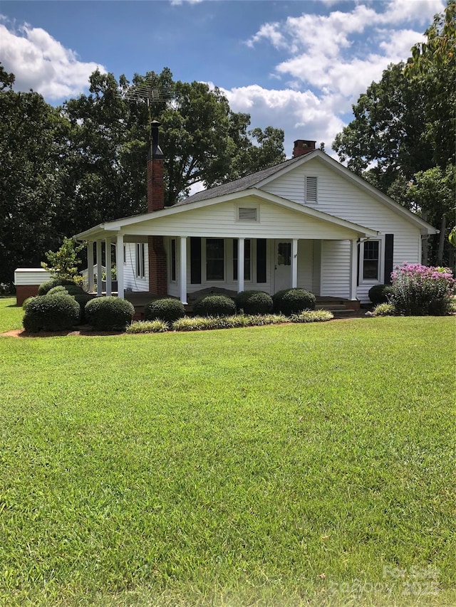 4896 Pageland Hwy, Lancaster, SC 29720 - view of front of property with a chimney, a front lawn, and a porch