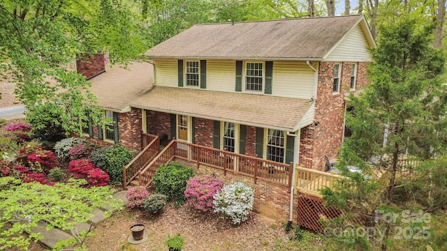 147 Spring Shore Rd, Statesville, NC 28677 - traditional home with a porch, a chimney, and a shingled roof