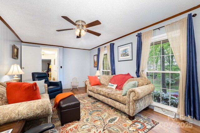 147 Spring Shore Rd, Statesville, NC 28677 - living room with ceiling fan, a textured ceiling, ornamental molding, and wood finished floors