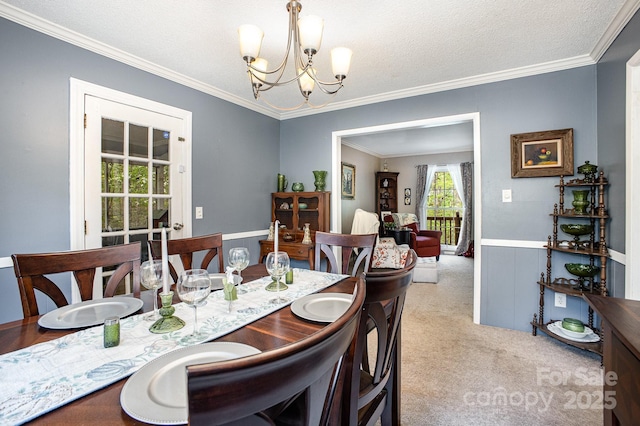 147 Spring Shore Rd, Statesville, NC 28677 - dining room featuring crown molding, carpet floors, and an inviting chandelier