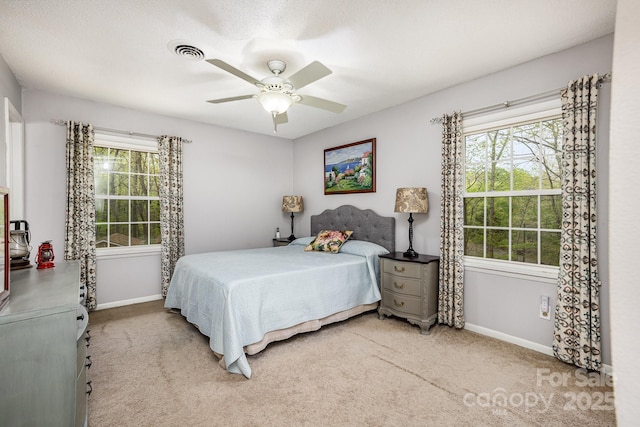 147 Spring Shore Rd, Statesville, NC 28677 - carpeted bedroom with baseboards, a ceiling fan, and visible vents
