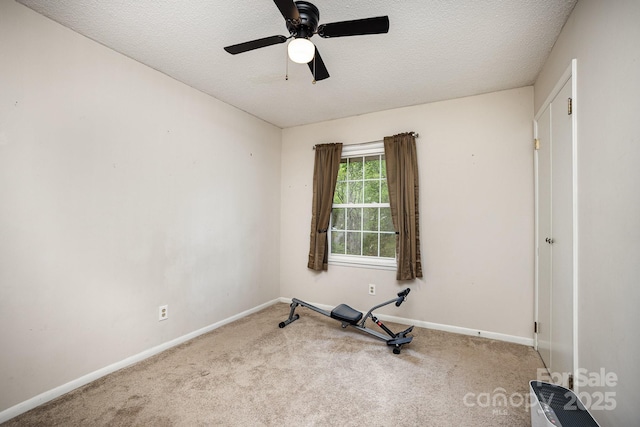 147 Spring Shore Rd, Statesville, NC 28677 - exercise room with baseboards, a textured ceiling, a ceiling fan, and carpet floors