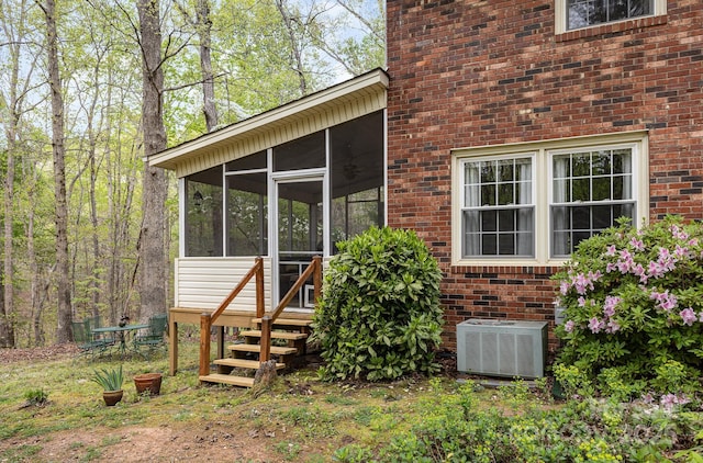147 Spring Shore Rd, Statesville, NC 28677 - exterior space with brick siding, a sunroom, and central air condition unit