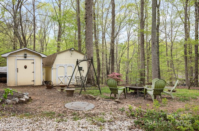 147 Spring Shore Rd, Statesville, NC 28677 - view of yard with an outdoor fire pit, an outbuilding, and a shed