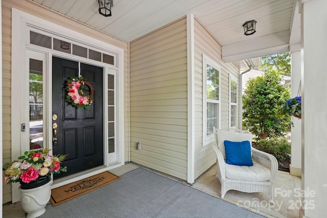 property entrance featuring covered porch