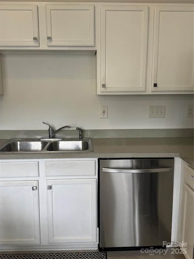 19416 Fridley Ln, Cornelius, NC 28031 - kitchen featuring stainless steel dishwasher, a sink, and white cabinetry