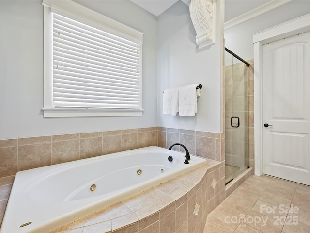 bathroom featuring a stall shower, tile patterned flooring, and a whirlpool tub