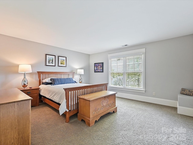 bedroom featuring light carpet, baseboards, and visible vents