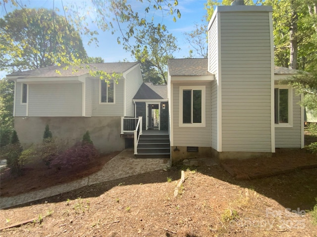 8000 Briardale Dr, Charlotte, NC 28212 - view of front of home with crawl space, a wooden deck, a chimney, and a shingled roof