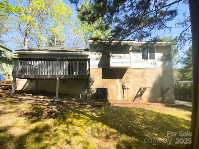 8000 Briardale Dr, Charlotte, NC 28212 - rear view of house featuring cooling unit, a yard, a wooden deck, and stucco siding