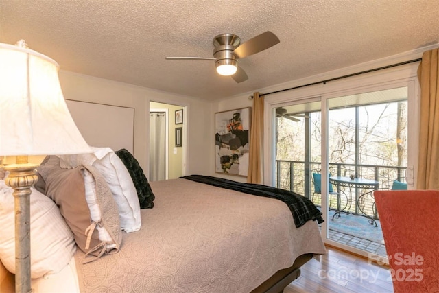 bedroom featuring a textured ceiling, ceiling fan, access to exterior, and wood finished floors