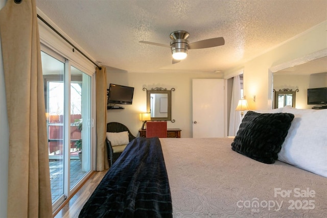 bedroom with access to outside, a ceiling fan, a textured ceiling, and wood finished floors