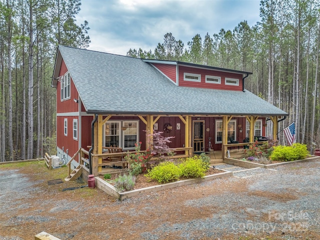 120 Ashley Ct, Mill Spring, NC 28756 - chalet / cabin with ac unit, covered porch, and roof with shingles