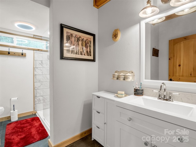 120 Ashley Ct, Mill Spring, NC 28756 - bathroom with a shower stall, vanity, baseboards, and toilet