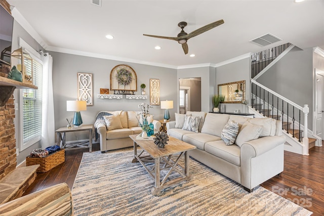 living room featuring stairway, ceiling fan, hardwood / wood-style floors, and visible vents