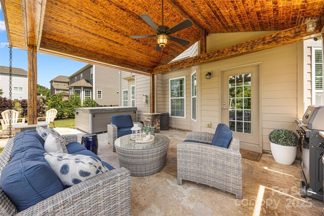 view of patio / terrace featuring a ceiling fan, outdoor lounge area, a hot tub, and area for grilling